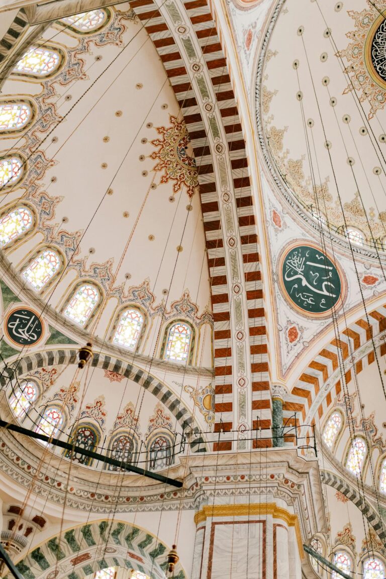 An intricate mosque interior painting, featuring vibrant colors and patterns that reflect Islamic artistic traditions.