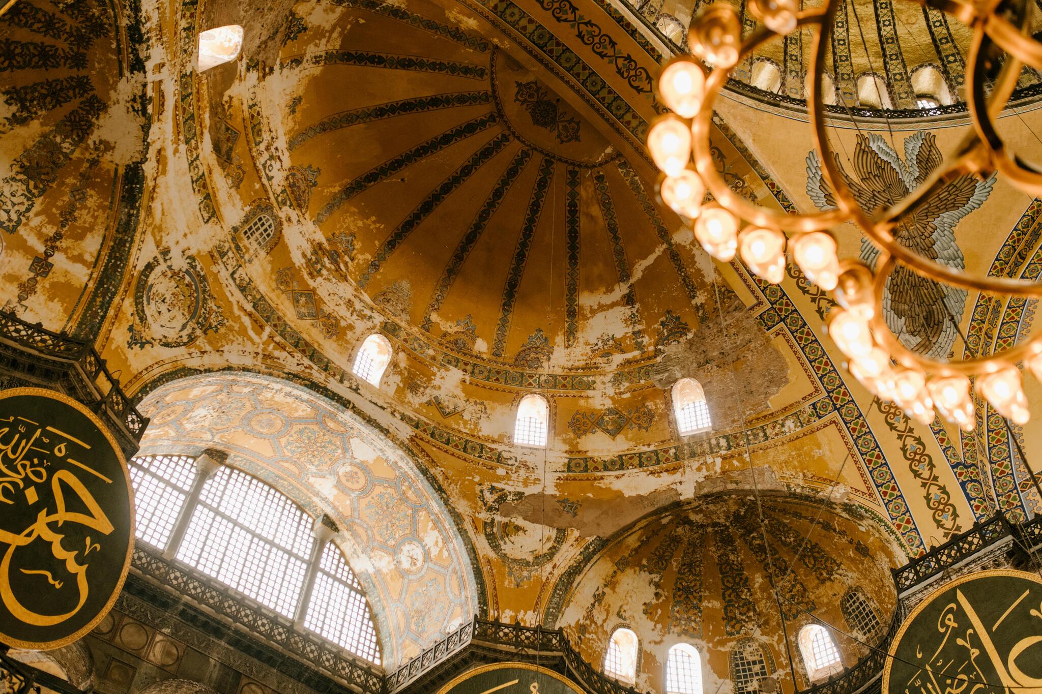 Interior of Mosque, showcasing its grand dome and historic decorations.