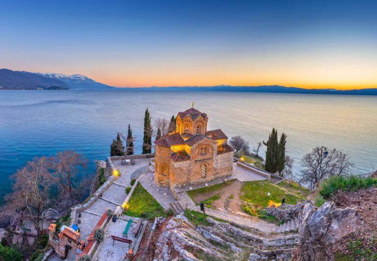 Sunset view of St. John at Kaneo Church overlooking Lake Ohrid in North Macedonia, part of our Unseen Balkans tour through Kosovo, Albania, and North Macedonia.