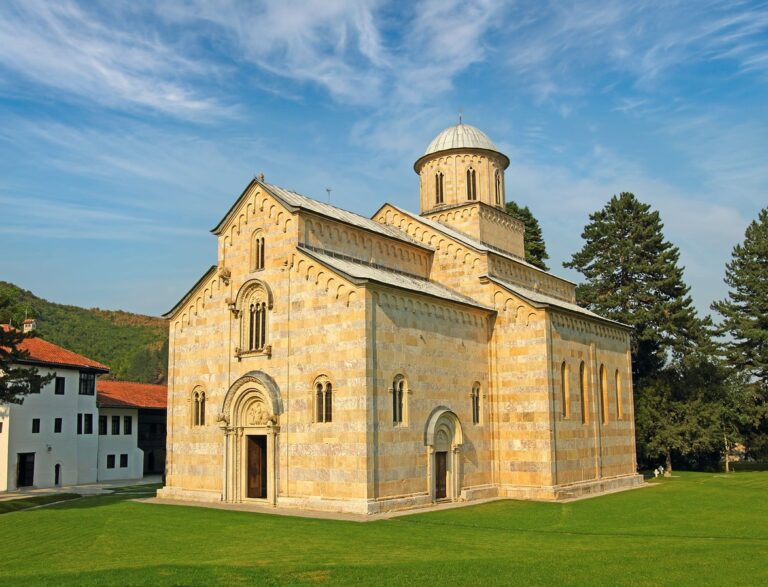 Visoki Decani Monastery, a UNESCO World Heritage site in Kosovo, captured from a street view, showcasing its stunning medieval Serbian Orthodox architecture.