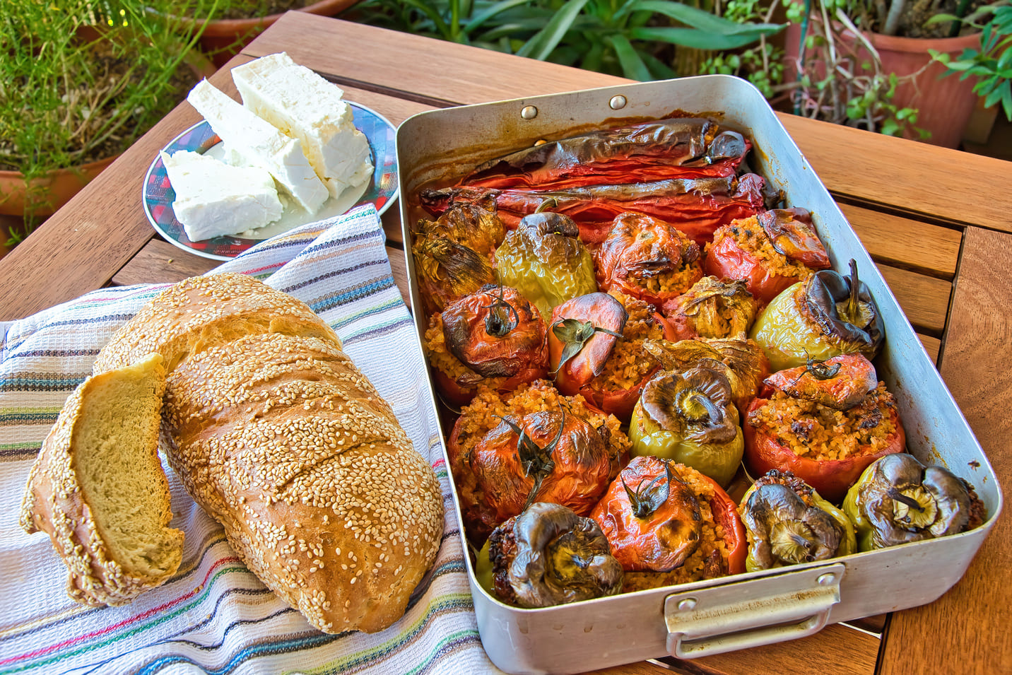 Farm-to-table lunch with stuffed rice peppers, cheese and bread