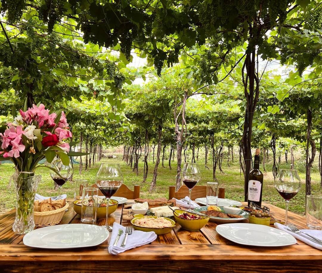 A beautifully set rustic table in Alpeta Winery and Farm to Table near Berat, central Albania
